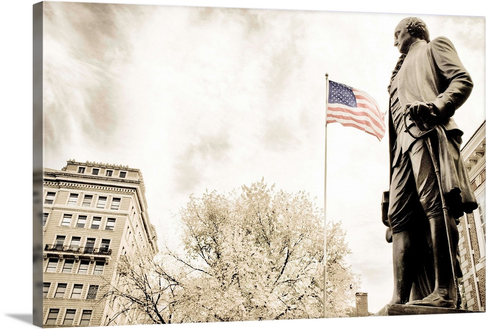 A statue of George Washington with the American flag in the background...shot in front of Independence Hall.