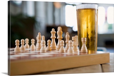 Glass of beer on chess board