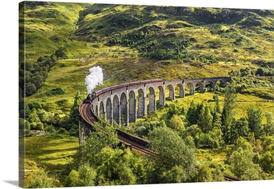 Glenfinnan Railway Viaduct In Scotland With A Steam Train