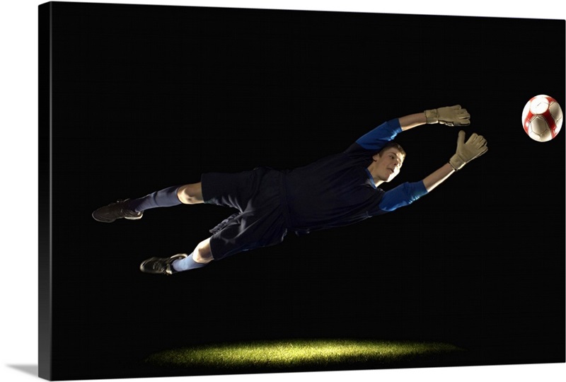 Goalie leaping to get soccer ball Wall Art, Canvas Prints, Framed