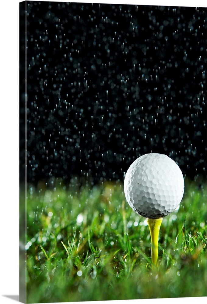 Golf ball on tee in rain