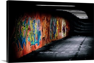 Graffiti in dark underground corridor