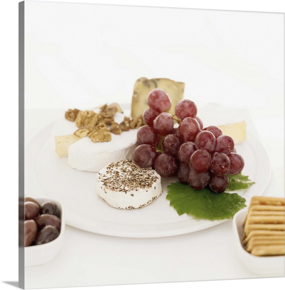 Grapes with cheese and crackers on a plate