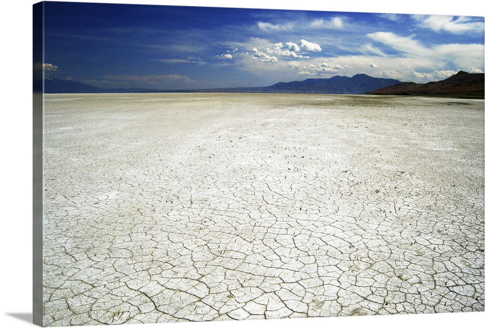 Wide-angle view of the cracked white surface of the Great Salt Lake salt flats, Antelope Island.