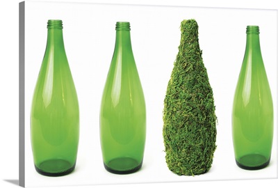 Green glass bottles showing recycling and conservation concept.
