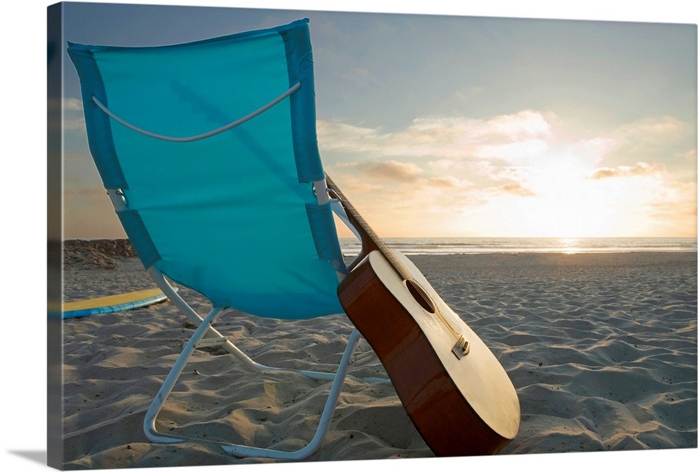 Guitar in lounge chair on beach Wall Art, Canvas Prints, Framed Prints