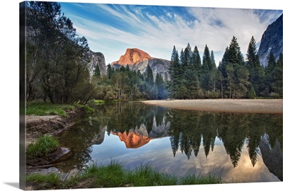 Half Dome reflecting in  Merced river in Yosemite National Park.