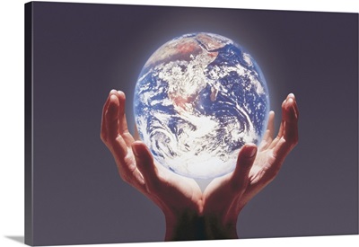 Hands cradling world