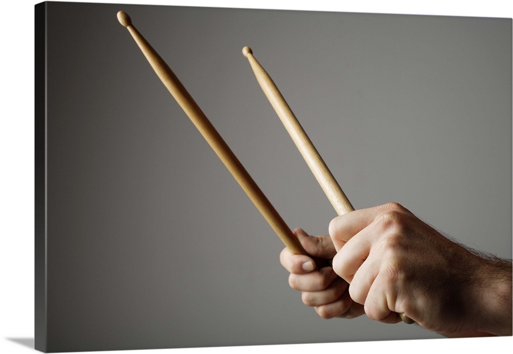 Hands holding drumsticks