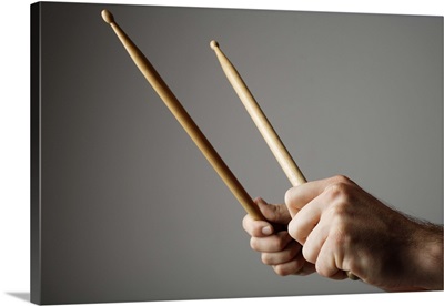 Hands holding drumsticks
