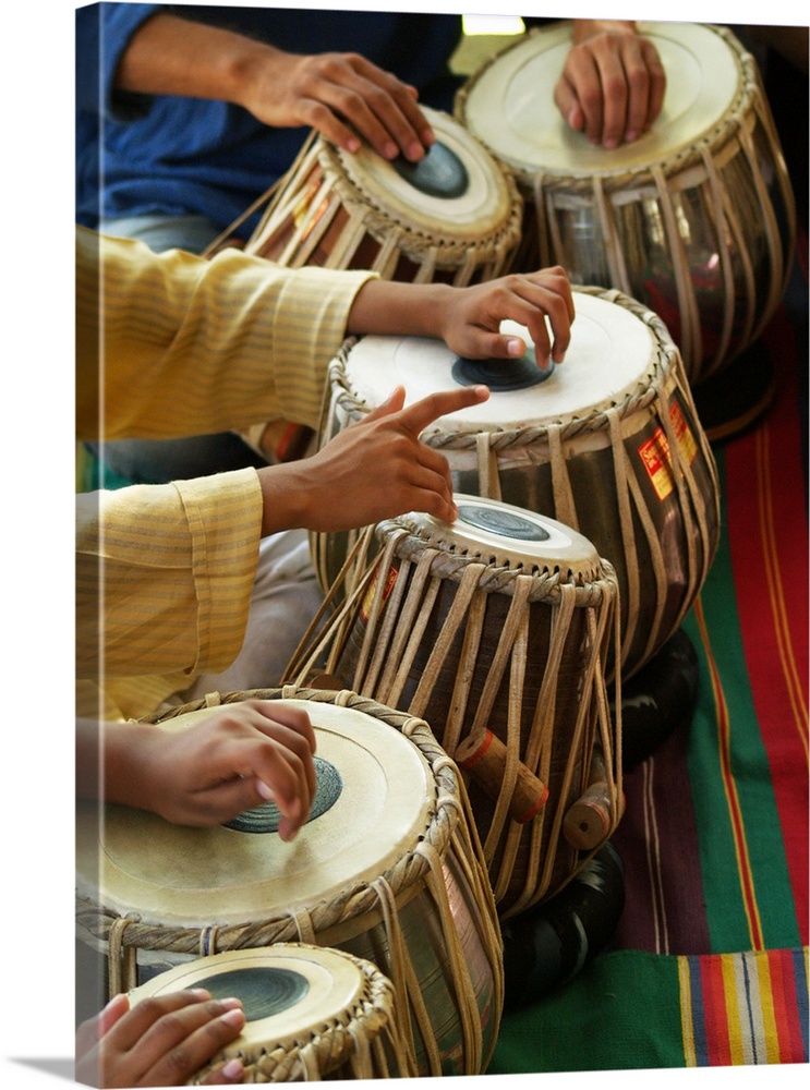 Close-up of hands playing tabla.