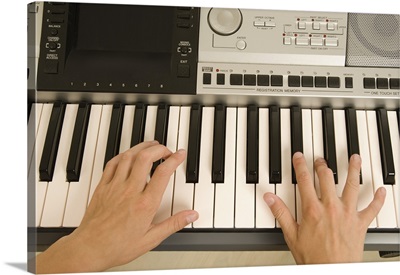 Hands playing keyboard