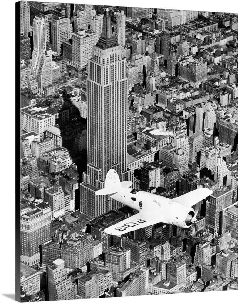New York: As Hawks Introduced New Plane To New York. An aerial view of Captain Frank Hawks' new speed plane as it flew ove...
