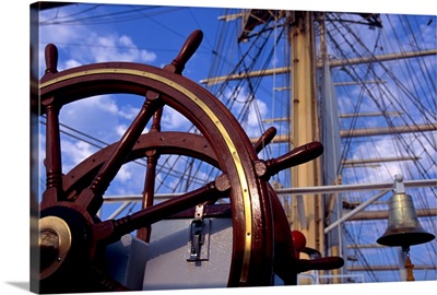 Helm and bare masts of clipper ship
