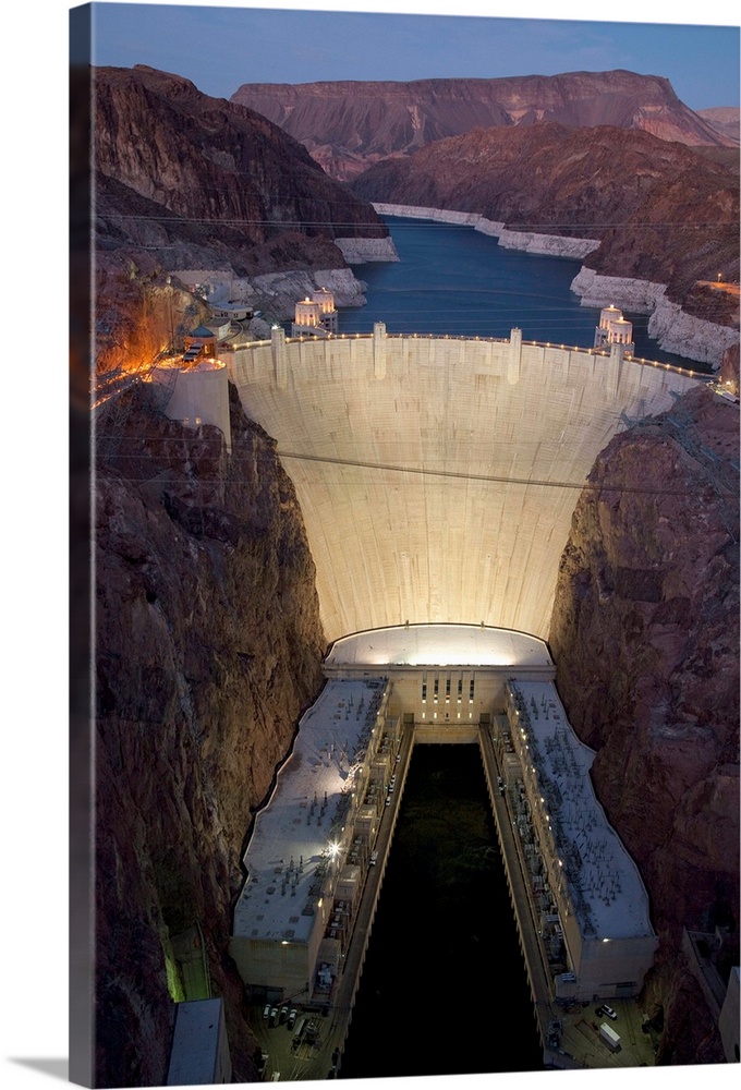Elevated view at dusk of Hoover Dam (formerly Boulder dam) and Lake Mead is in the Black Canyon of the Colorado River on t...
