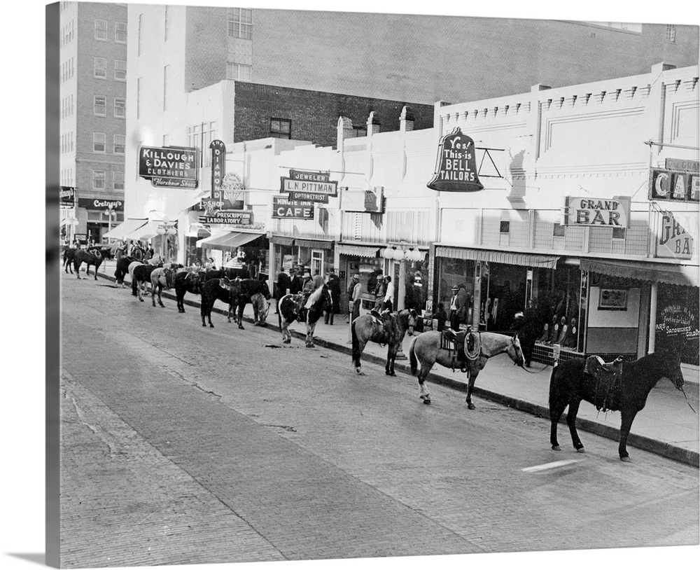 1/28/42-Amarillo, Texas: Forty Amarillo businessmen rode horse to work to save wear and tear on tires. Hitch came when hor...