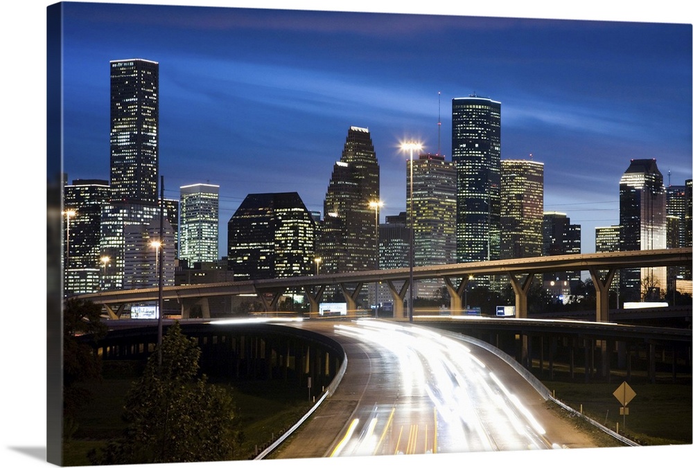 Houston skyline at dusk with freeway in foreground