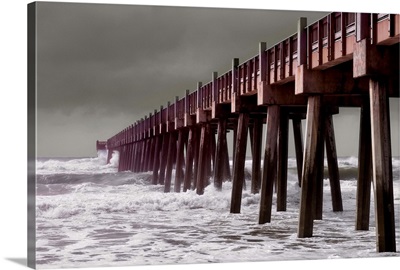 Hurricane waves crash into pier