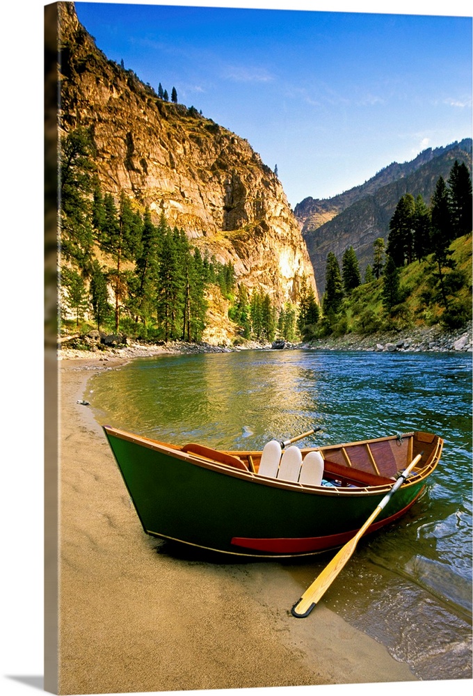 IDAHO, Fishing boat on a sandy beach in the canyons of the Middle Fork of the Salmon River.