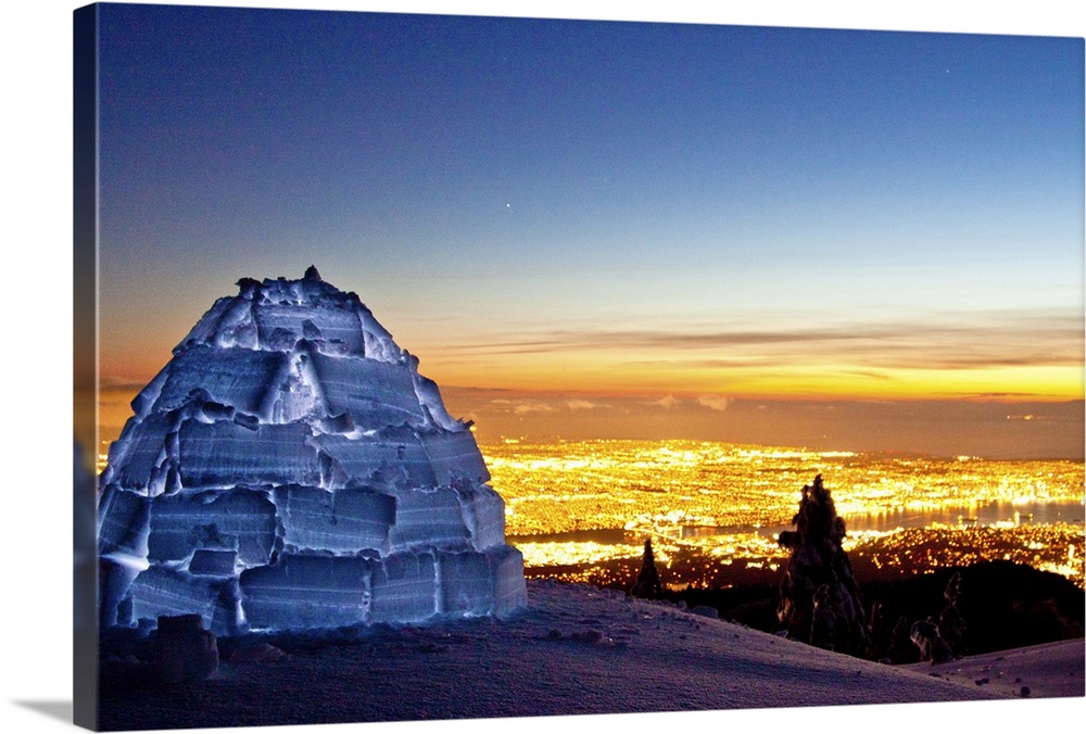 Igloo illuminated on Seymour mountain just after sunset city night lights of Vancouver, Canada.