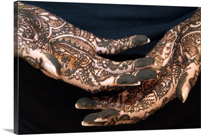 Indian bride's hands with Mehndi henna designs