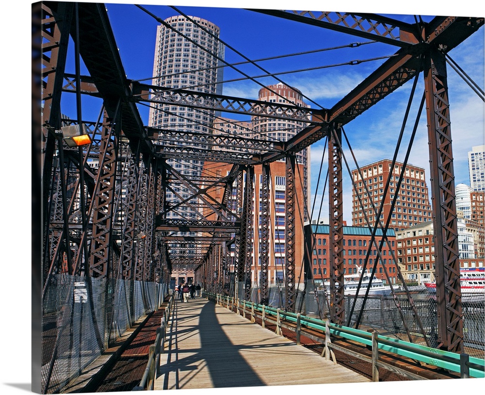 Iron footbridge with Boston Financial district in background