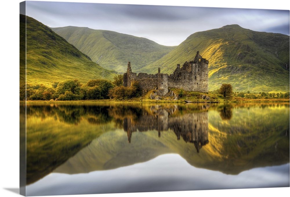 Kilchurn Castle reflections in Loch Awe at sunset in Scotland.
