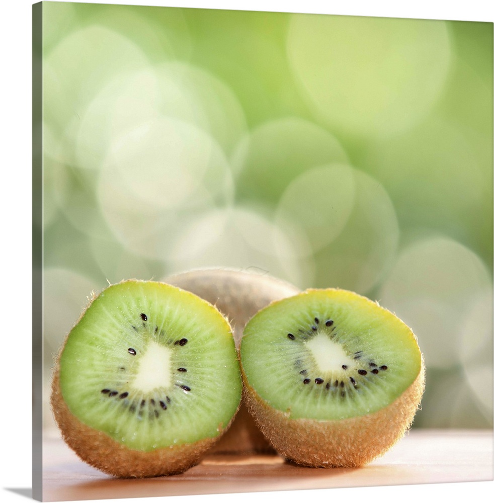 Kiwi fruit against bokeh background.
