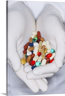 Lab Worker with Hands Full of Pills