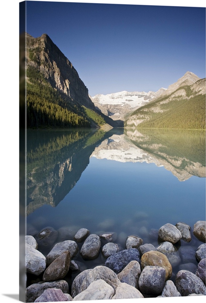 Victoria Glacier and Canadian Rocky Mountains reflected in Lake Louise.  Banff National Park, Alberta, Canada.