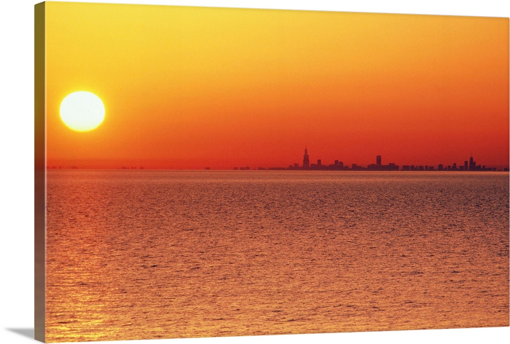 USA,Chicago,Lake Michigan,orange sunset,city skyline in distance