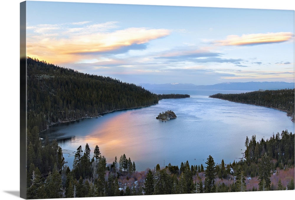 Emerald bay in lake Tahoe glows with reflection of springtime sunset.