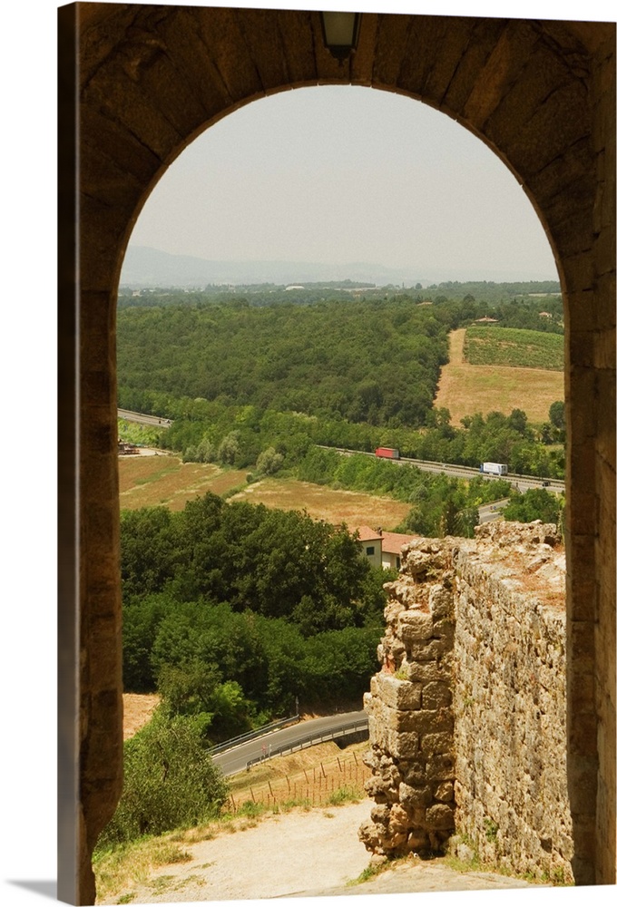 Landscape viewed through an archway, Porta Franca, Monteriggioni, Siena Province, Tuscany, Italy