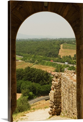 Landscape viewed through an archway in Monteriggioni, Tuscany, Italy