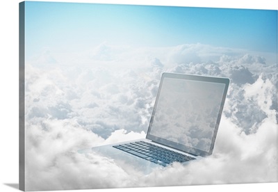 Laptop floating in clouds