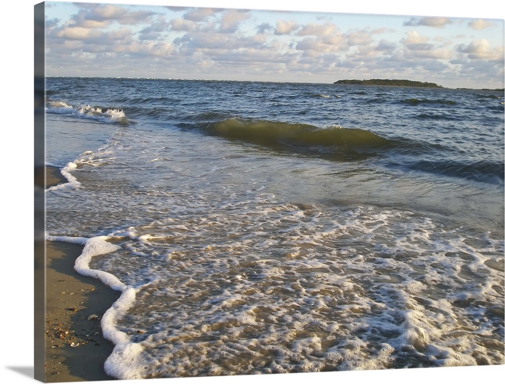 Incoming surf photographed on the Back River of Tybee Island, Georgia, USA.