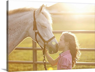 Little Girl Kissing Her Horse