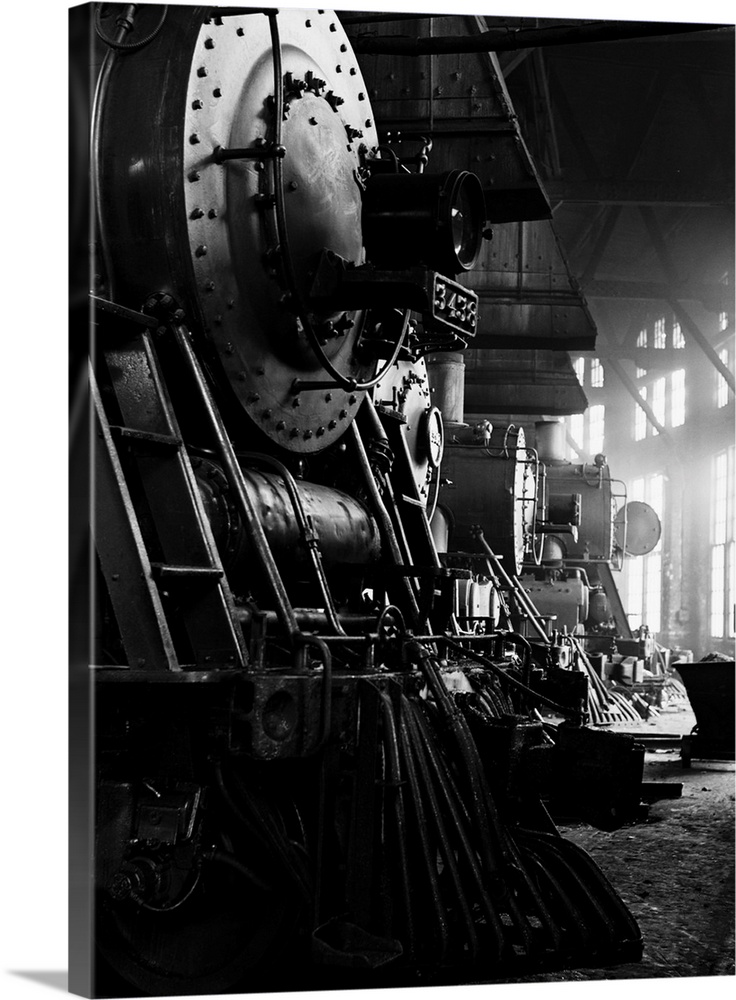 Locomotives in the Atchison, Topeka and Santa Fe Railway roundhouse in Shopton, near Fort Madison, Iowa. Note train contro...