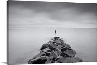 Long exposure black and white image of rock jetty at Breezy Point.