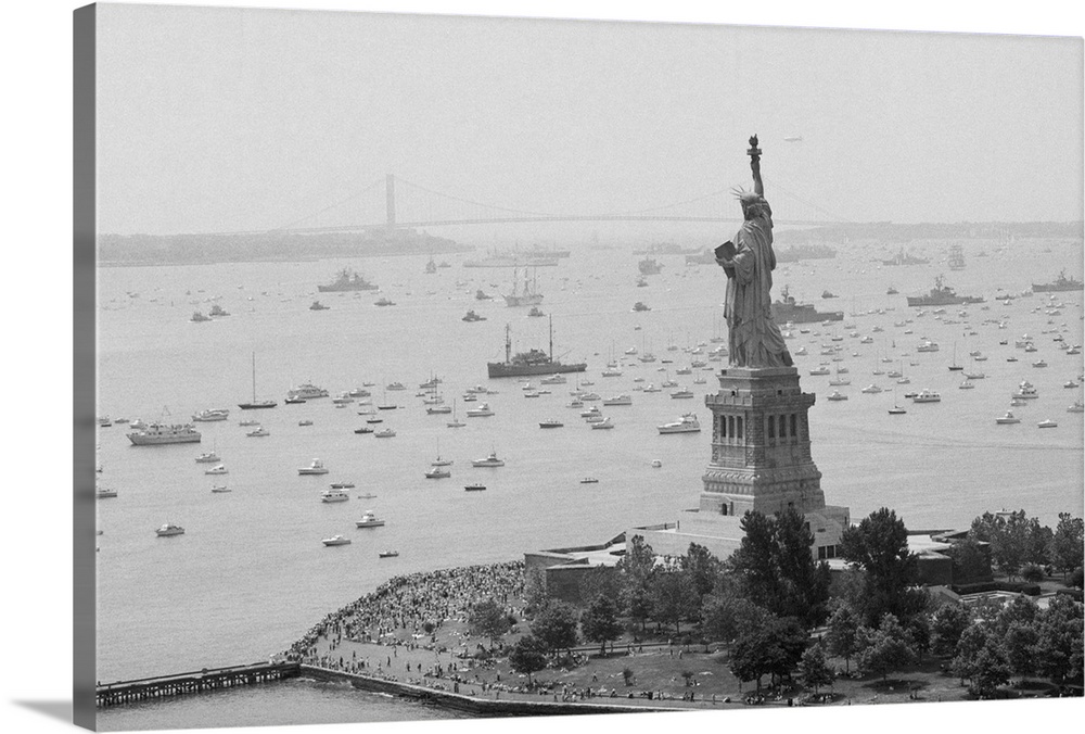 NEW YORK: Long line of ships sails past Statue of Liberty in New York Harbor here 7/4 as they take part in Operation Sail ...
