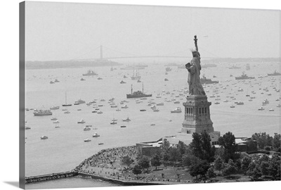 Long Line Of Ships Sails Past Statue of Liberty