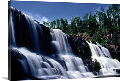 Low angle view of three waterfalls