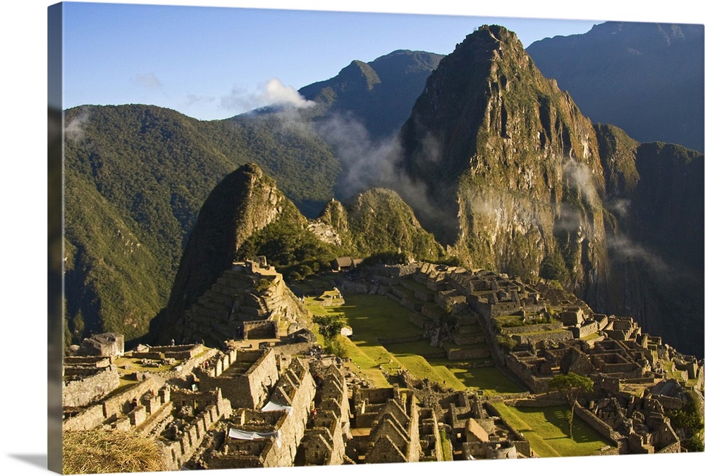 Machu Picchu as the last of the morning fog burns off the lost Inca city