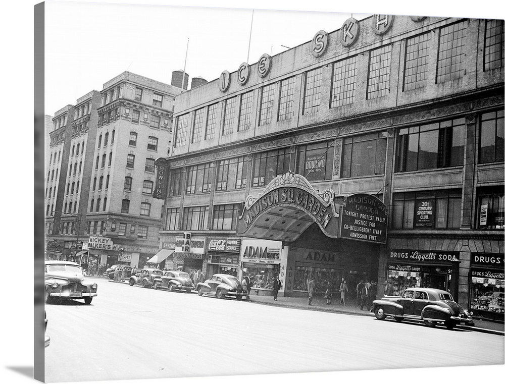 New York, New York: Madison Square Garden. Exterior shot of entry showing marquess and street area. Automobiles parked out...