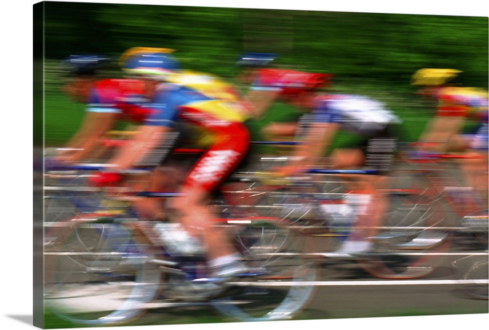 Male cyclist riding bicycle (blurred motion)