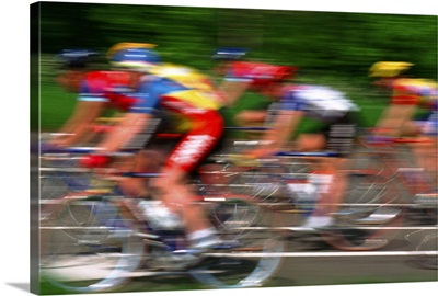 Male cyclist riding bicycle (blurred motion)
