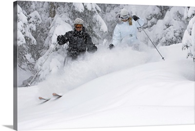 Man and woman snow skiing