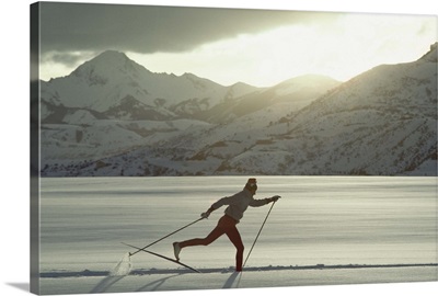 Man cross country skiing, side view
