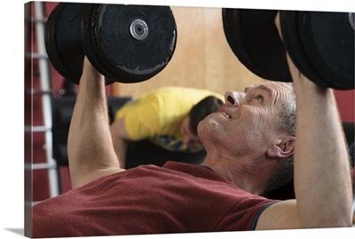 Man lifting weights at gym