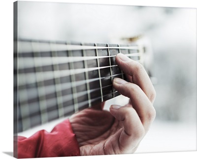 Man playing guitar, close up